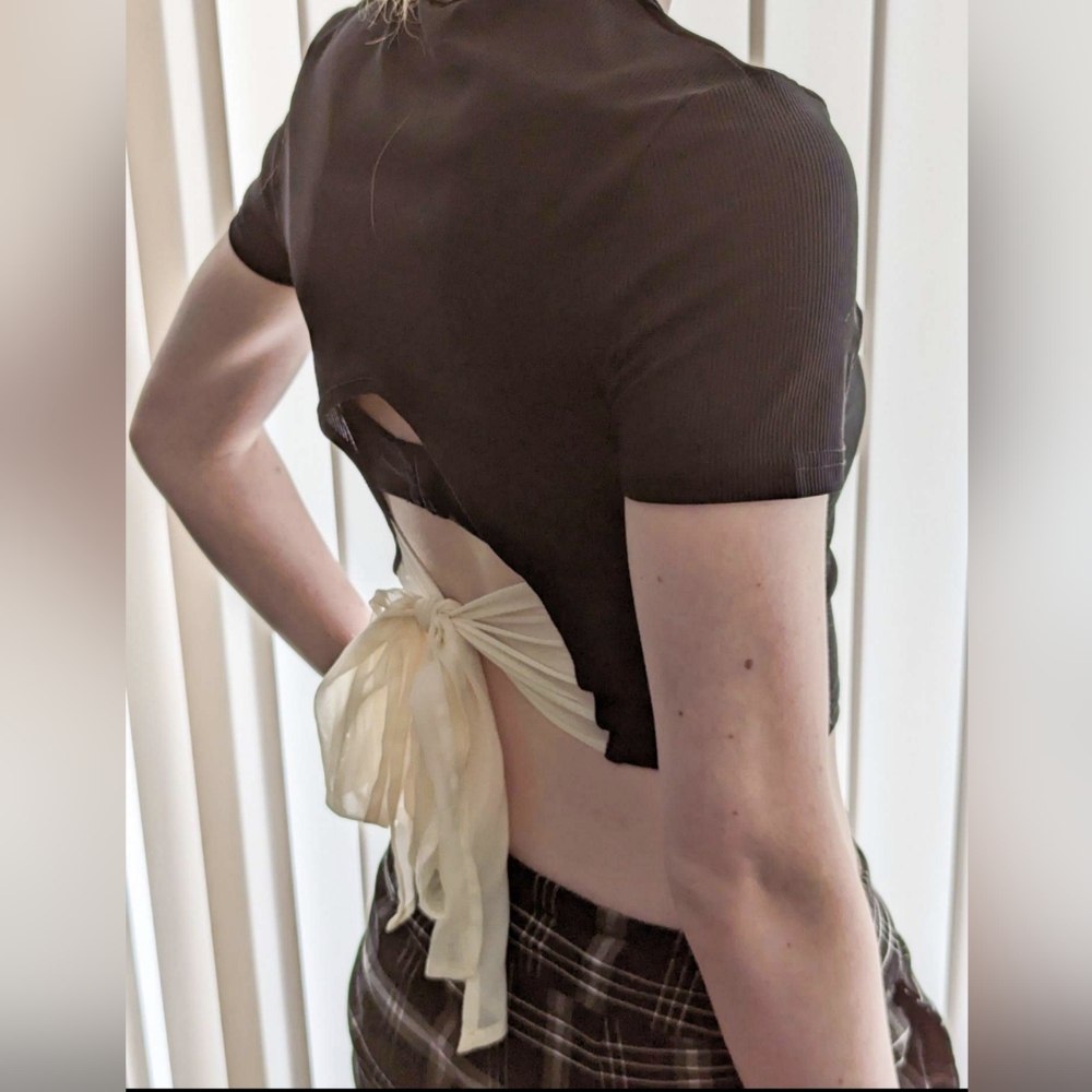 Cropped black blouse with cream ribbon tie on the back